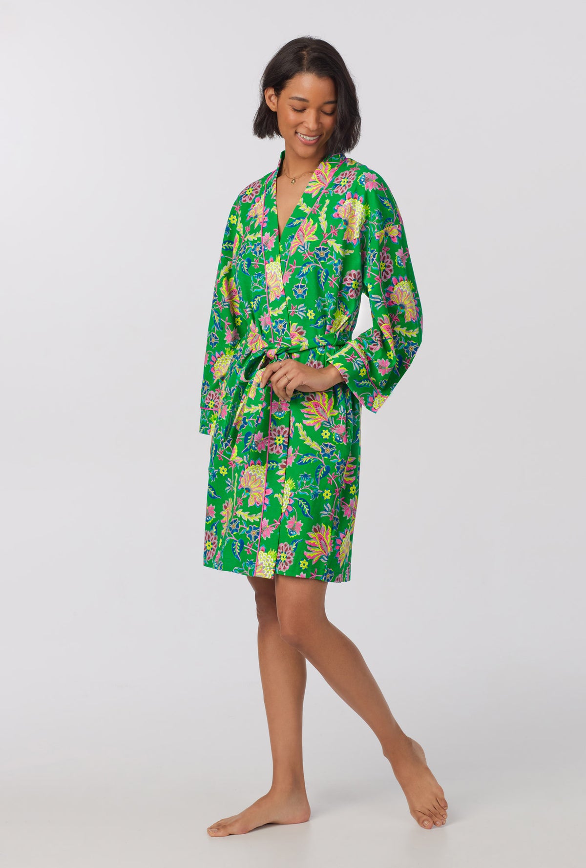 A lady wearing Banded Collar Stretch Jersey Robe with royal garden print