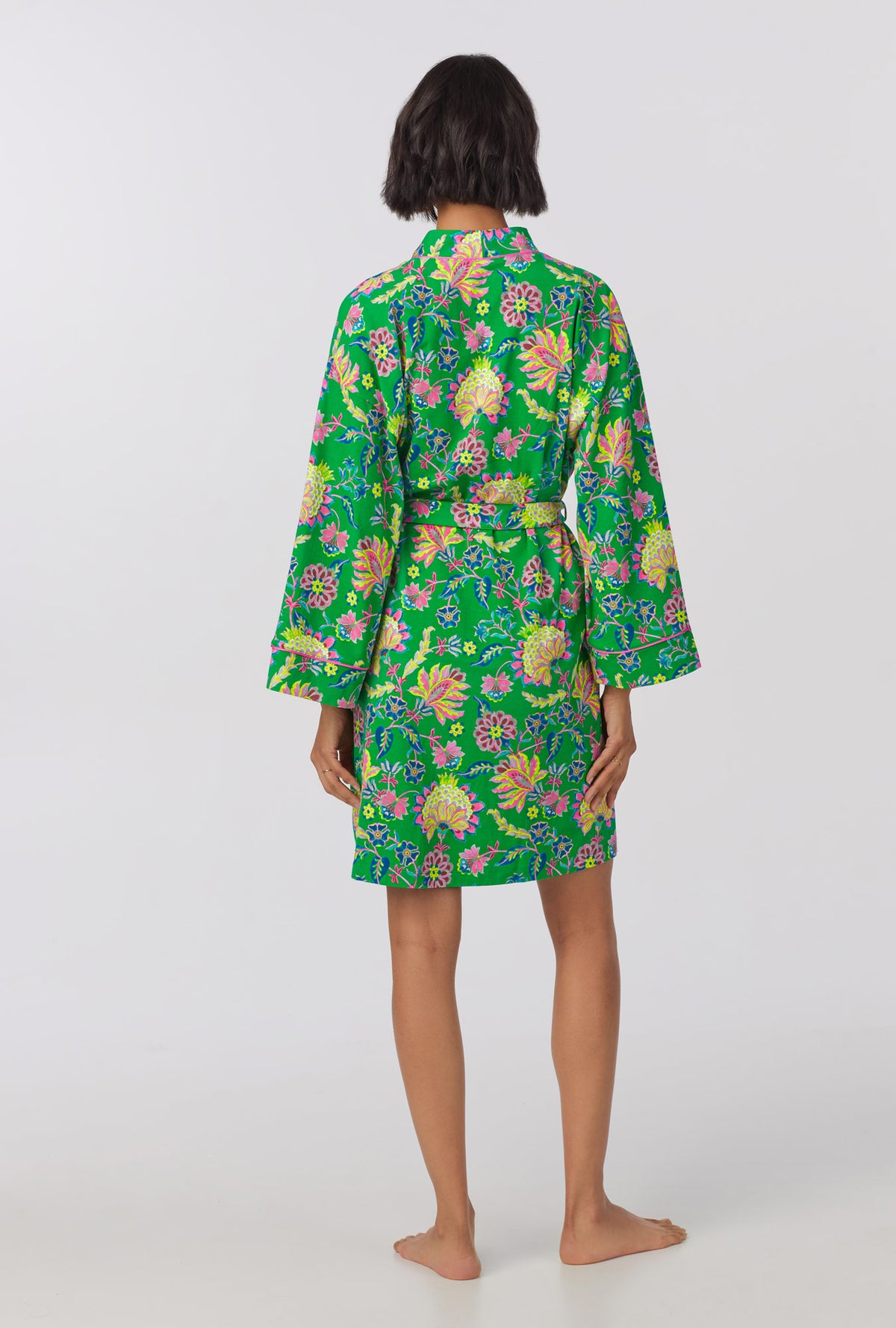 A lady wearing Banded Collar Stretch Jersey Robe with royal garden print