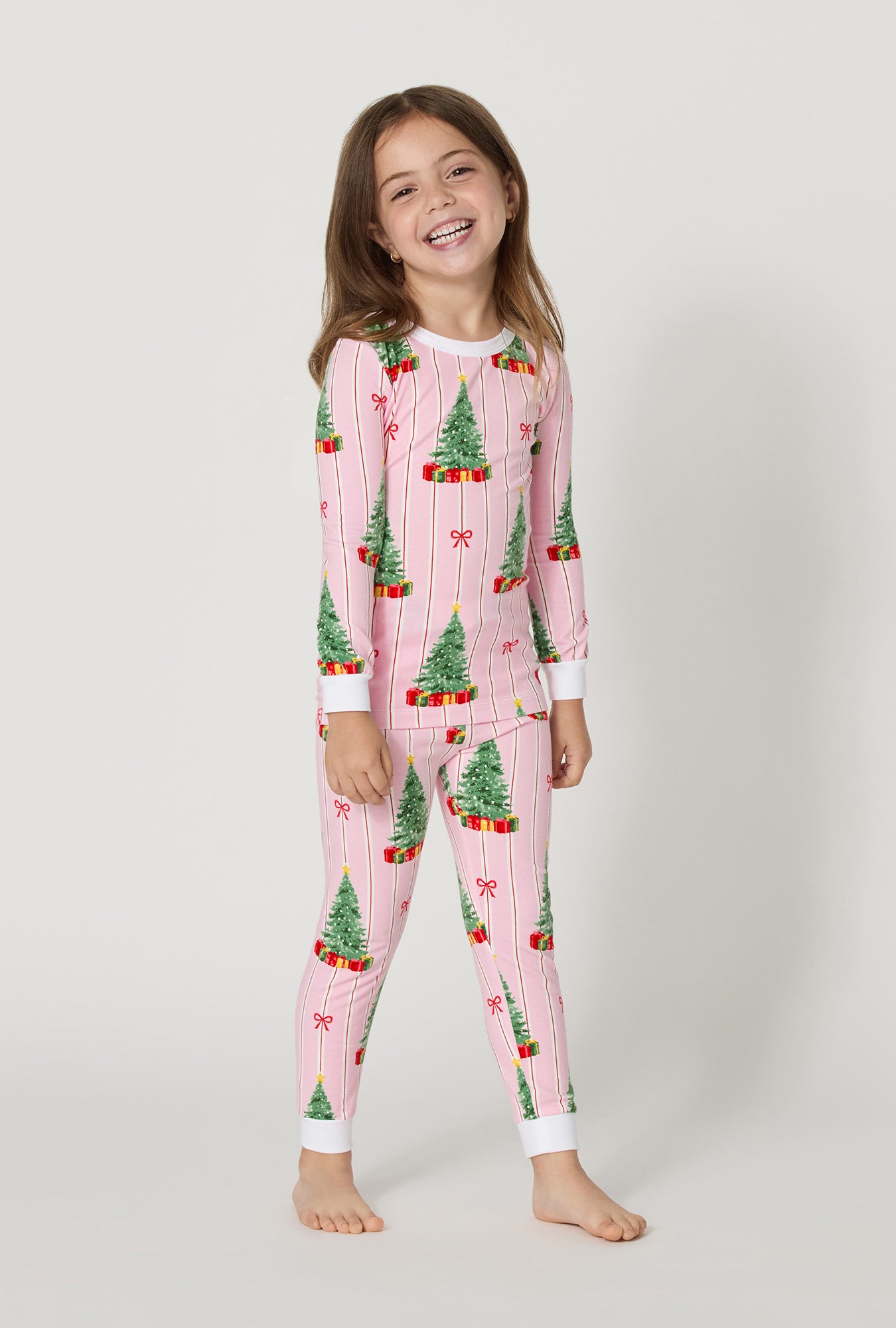 A girl wearing Pretty In Pine Long Sleeve Stretch Jersey Kids Pj Set