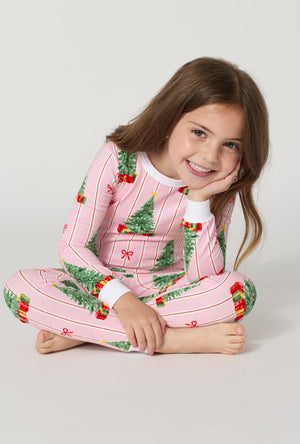 A girl wearing Pretty In Pine Long Sleeve Stretch Jersey Kids Pj Set sitting down