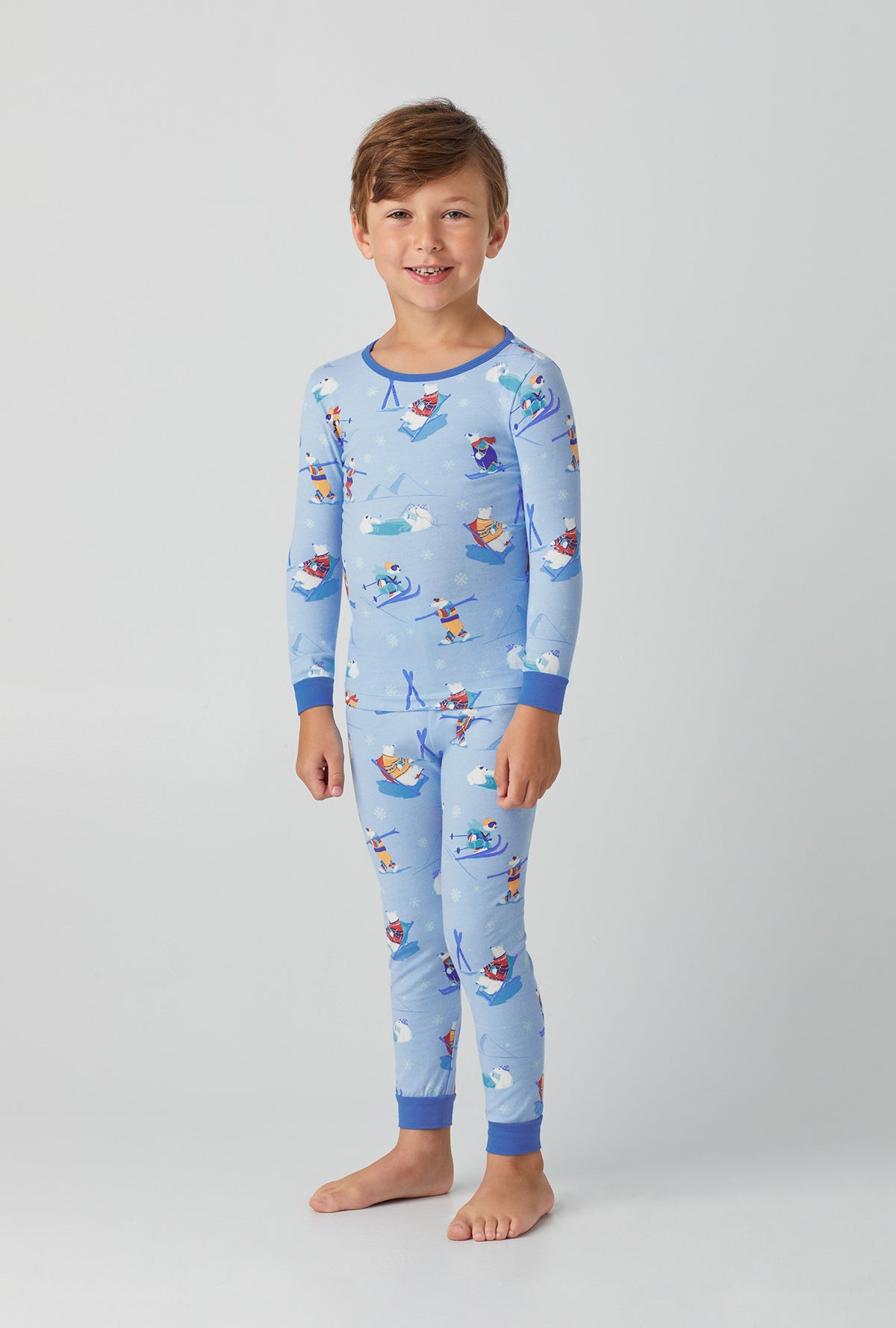 A kid wearing  light blue Long Sleeve Stretch Jersey Kids PJ Set with Backcountry Bears print