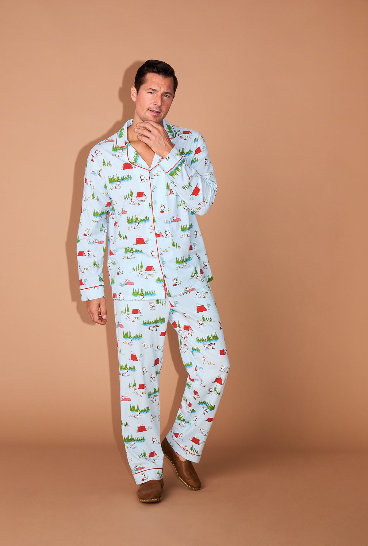 A man wearing Peanuts® Camp Snoopy Men&#39;s Long Sleeve Classic Stretch Jersey PJ Set