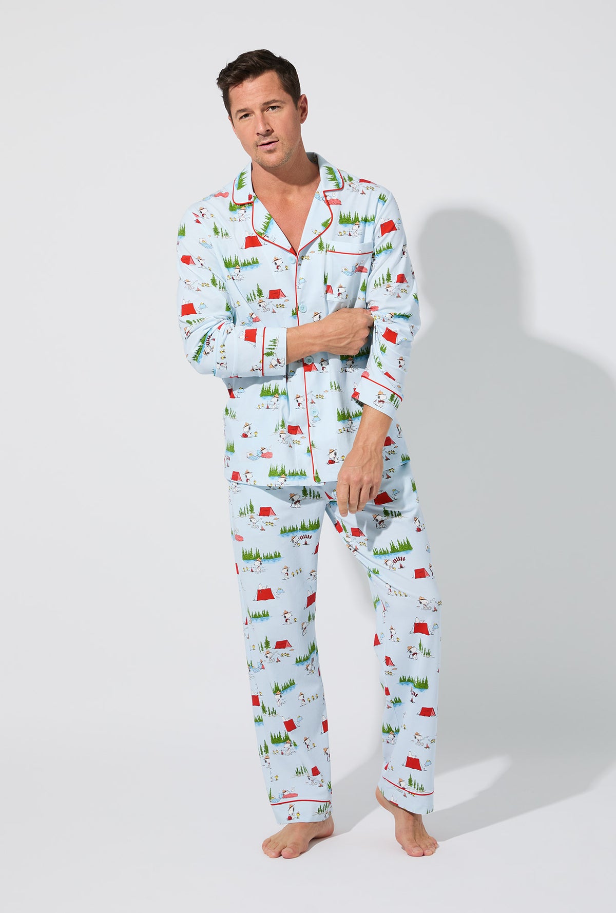 A man wearing Peanuts® Camp Snoopy Men&#39;s Long Sleeve Classic Stretch Jersey PJ Set