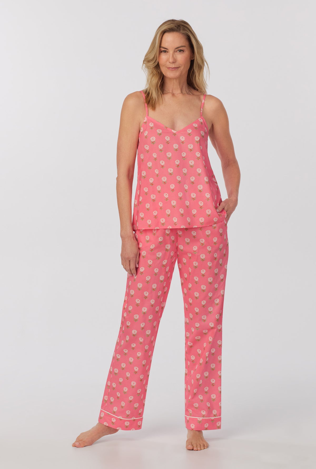 A lady wearing cami tank woven cotton poplin long pj set with monarch flowers print