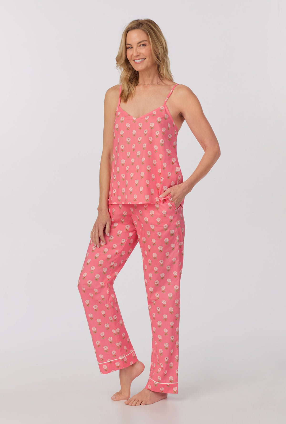 A lady wearing cami tank woven cotton poplin long pj set with monarch flowers print