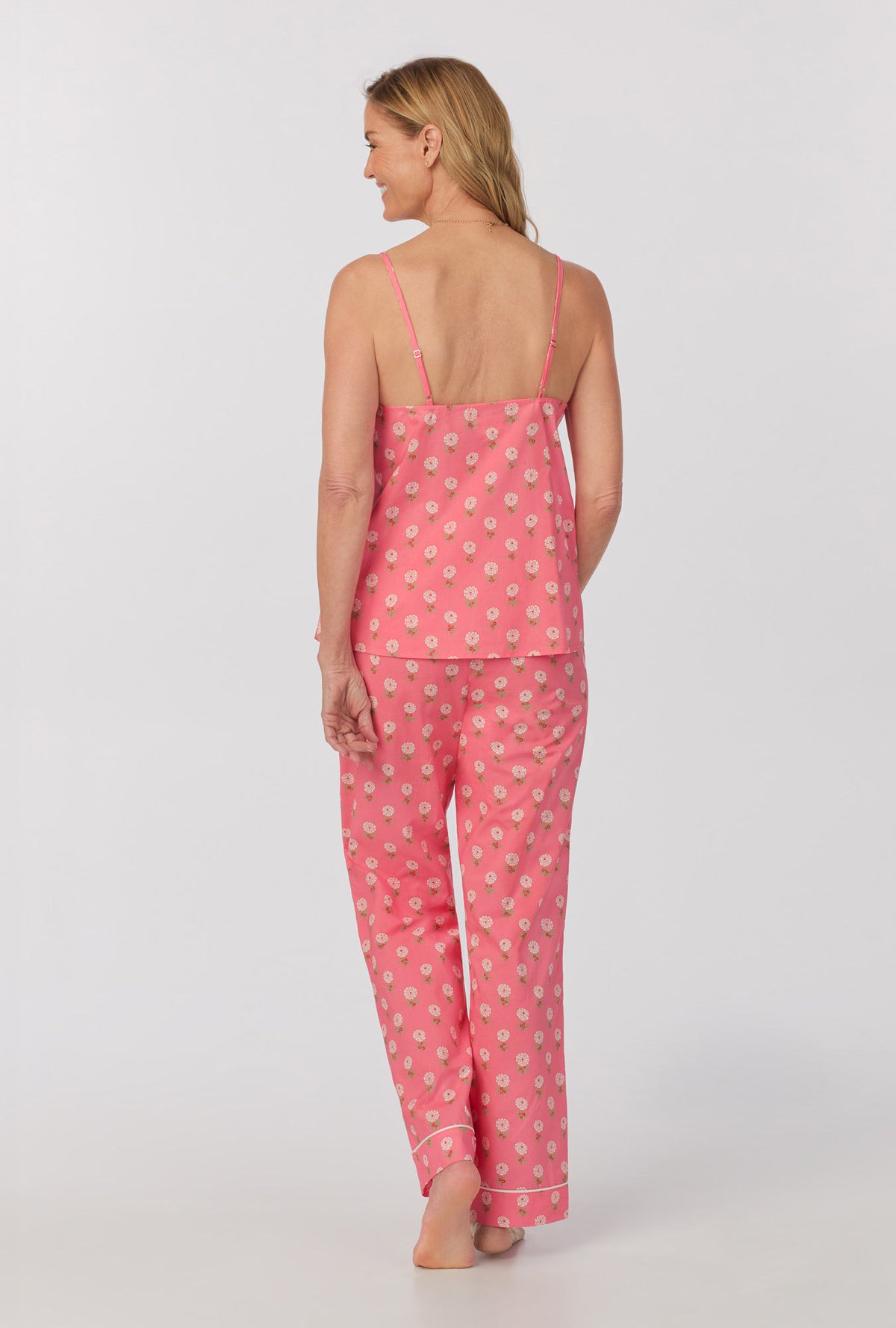 A lady wearing cami tank woven cotton poplin long pj set with monarch flowers print