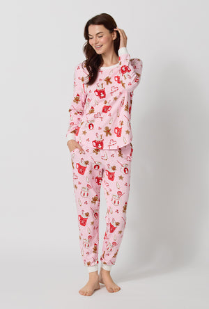 A lady wearing Candy And Cocoa Long Sleeve Pullover Crew And Jogger Stretch Jersey Pj Set looking down