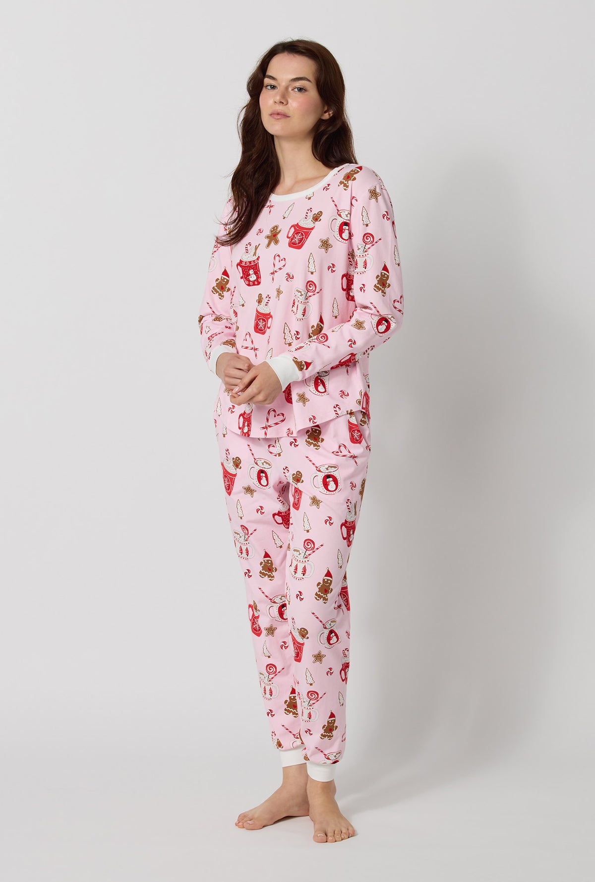 A lady wearing Candy And Cocoa Long Sleeve Pullover Crew And Jogger Stretch Jersey Pj Set