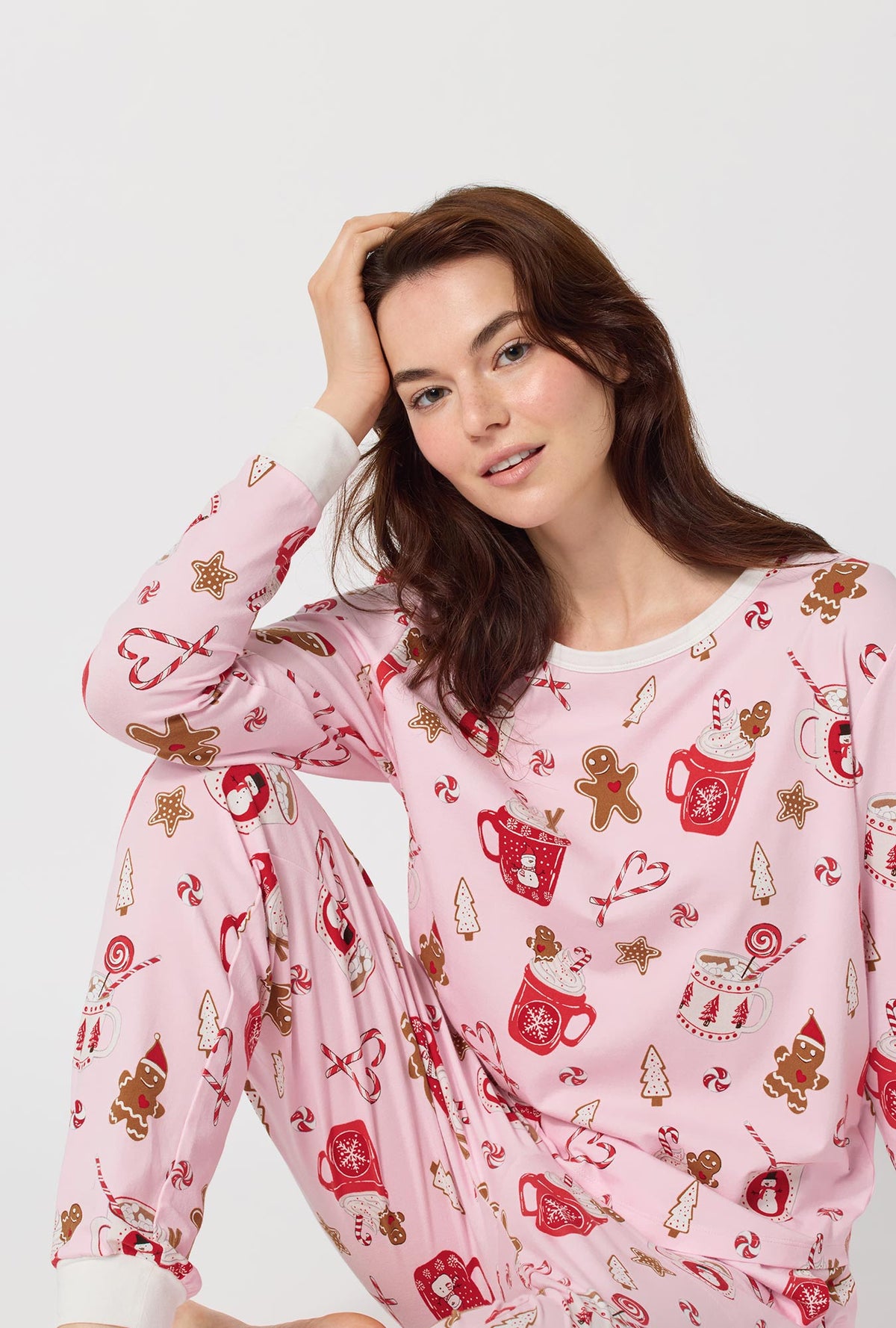 A lady wearing Candy And Cocoa Long Sleeve Pullover Crew And Jogger Stretch Jersey Pj Set closer look