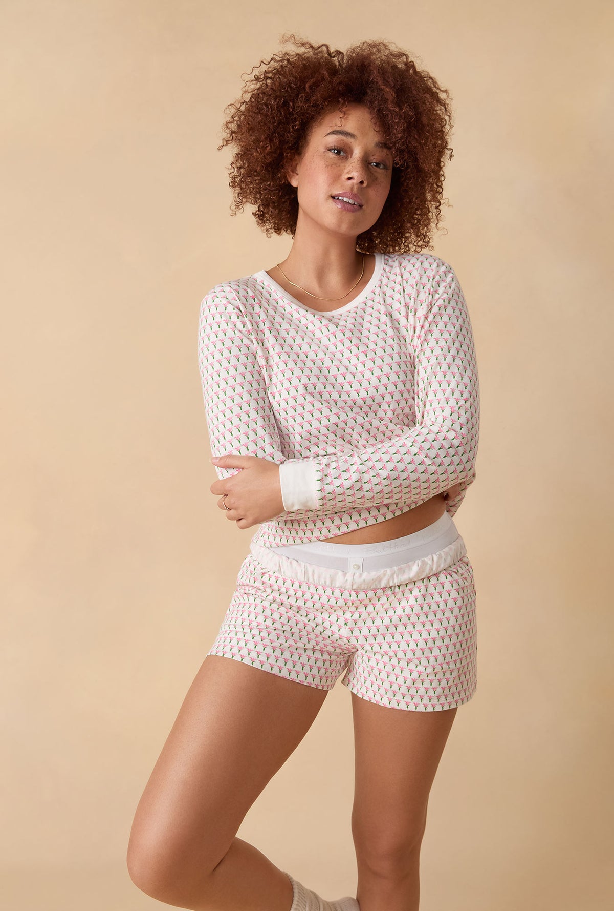 A lady wearing Blossom Geo Long Sleeve Pullover Crew And Shorty Stretch Jersey Pj Set