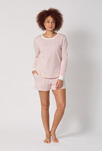 A lady wearing Blossom Geo Long Sleeve Pullover Crew And Shorty Stretch Jersey Pj Set