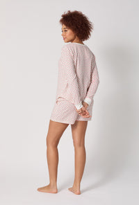 A lady wearing Blossom Geo Long Sleeve Pullover Crew And Shorty Stretch Jersey Pj Set