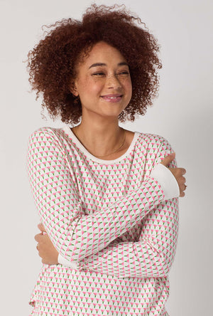 A lady wearing Blossom Geo Long Sleeve Pullover Crew And Shorty Stretch Jersey Pj Set