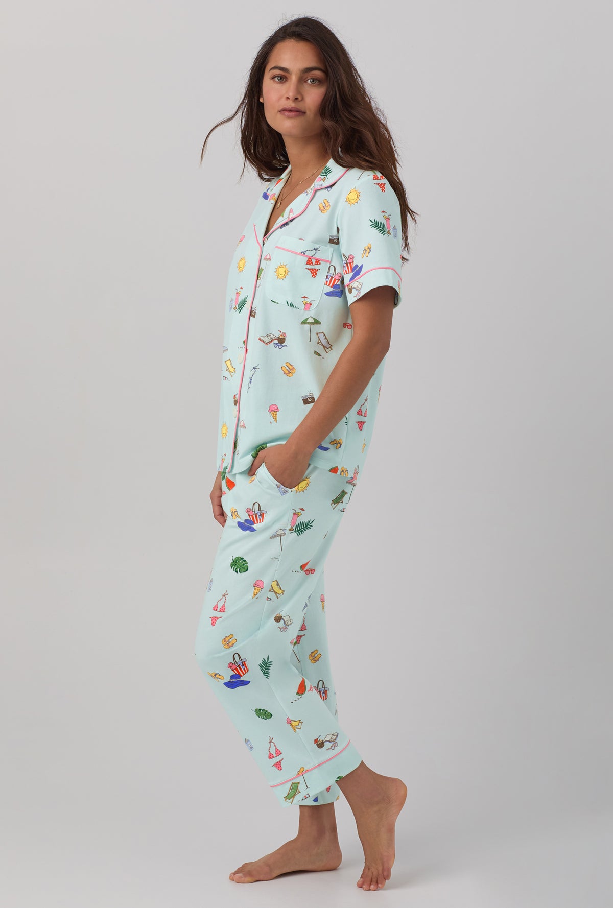 A lady wearing blue short sleeve classic stretch jersey cropped pj set with beach day print