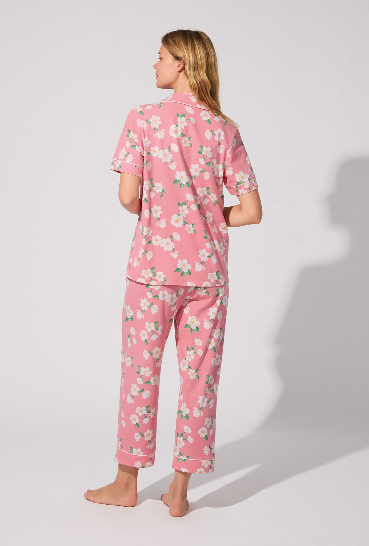 A lady wearing Pink Magnolias Short Sleeve Classic Stretch Jersey Cropped PJ Set