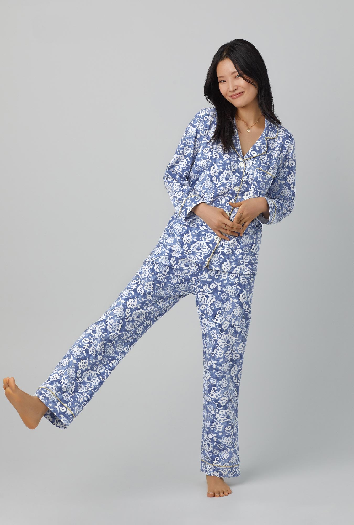 A lady wearing long sleeve classic stretch jersey pj set with autumn eve print