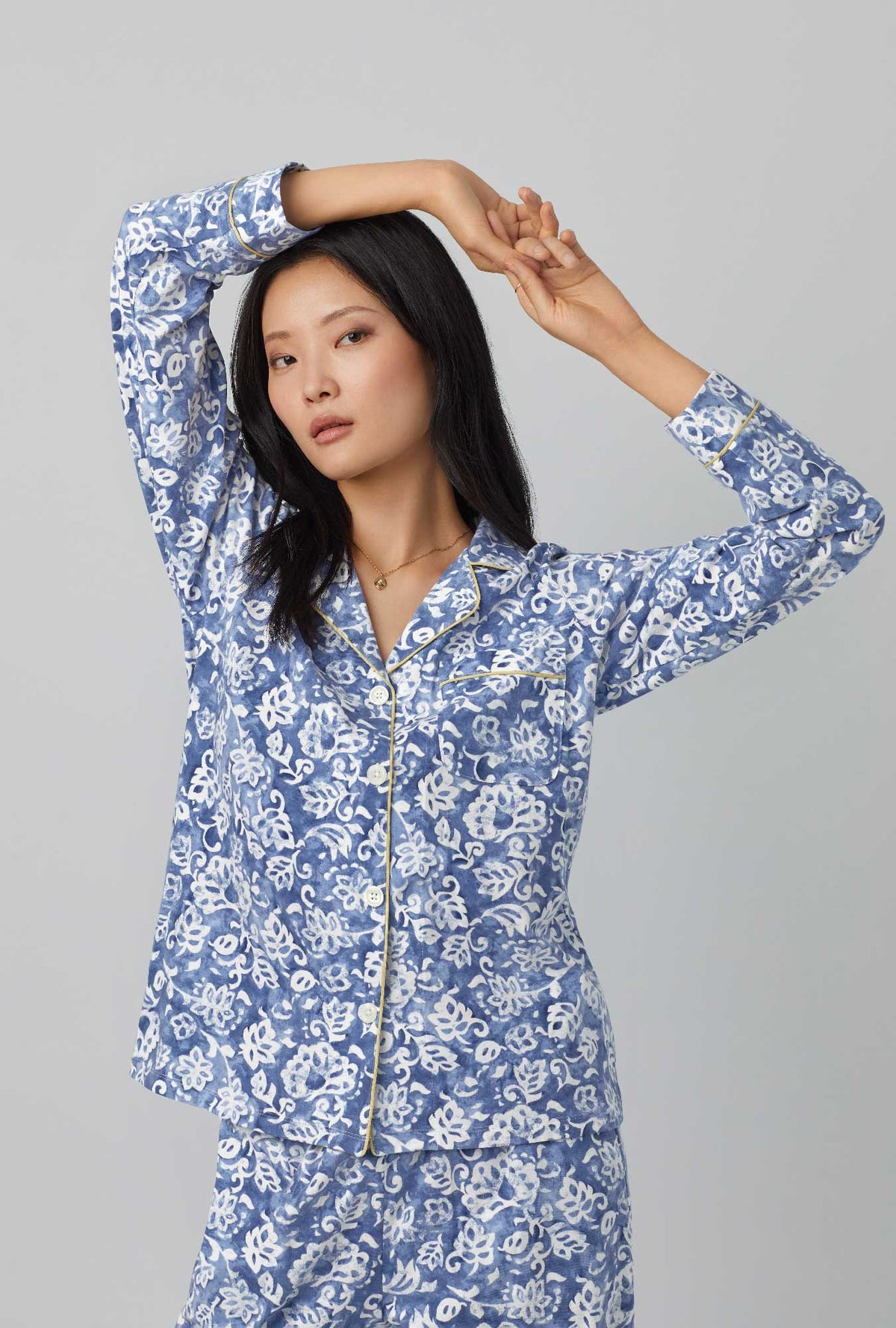 A lady wearing long sleeve classic stretch jersey pj set with autumn eve print