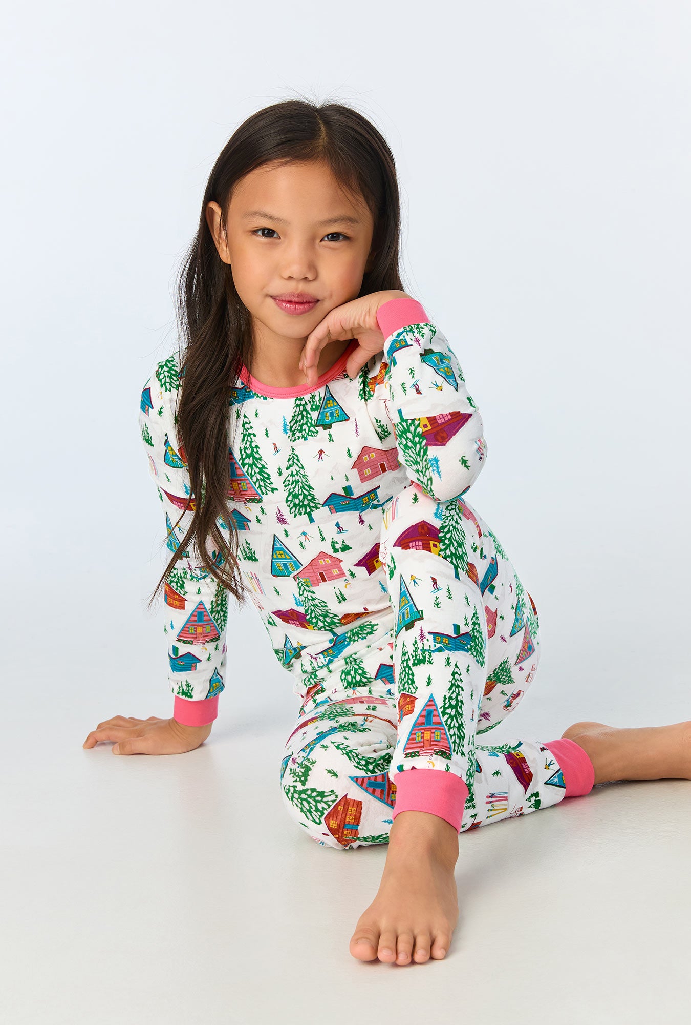 A child wearing Alphine Cabins Long Sleeve Stretch Jersey Kids PJ Set