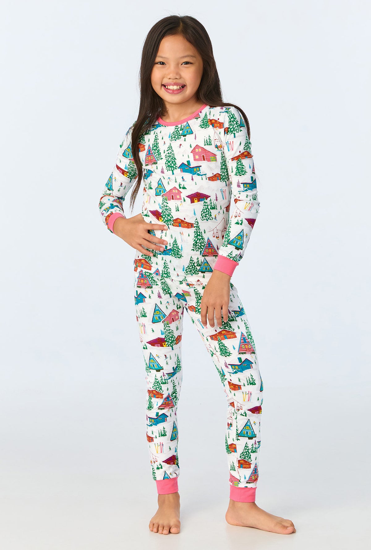 A child wearing Alphine Cabins Long Sleeve Stretch Jersey Kids PJ Set