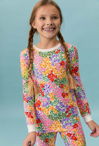 A girl wearing Spring Fields Long Sleeve Stretch Jersey Kids Pj Set