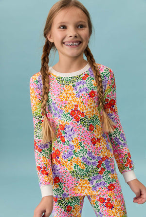 A girl wearing Spring Fields Long Sleeve Stretch Jersey Kids Pj Set