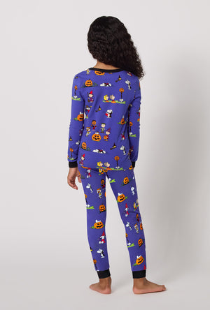 A Girl Wearing Spooky Season Snoopy Long Sleeve Stretch Jersey Kids Pj Set in a back view pose