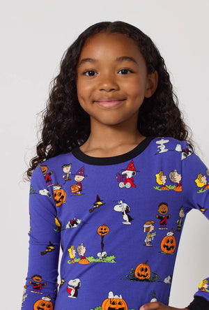 A Girl Wearing Spooky Season Snoopy Long Sleeve Stretch Jersey Kids Pj Set in a close up view pose