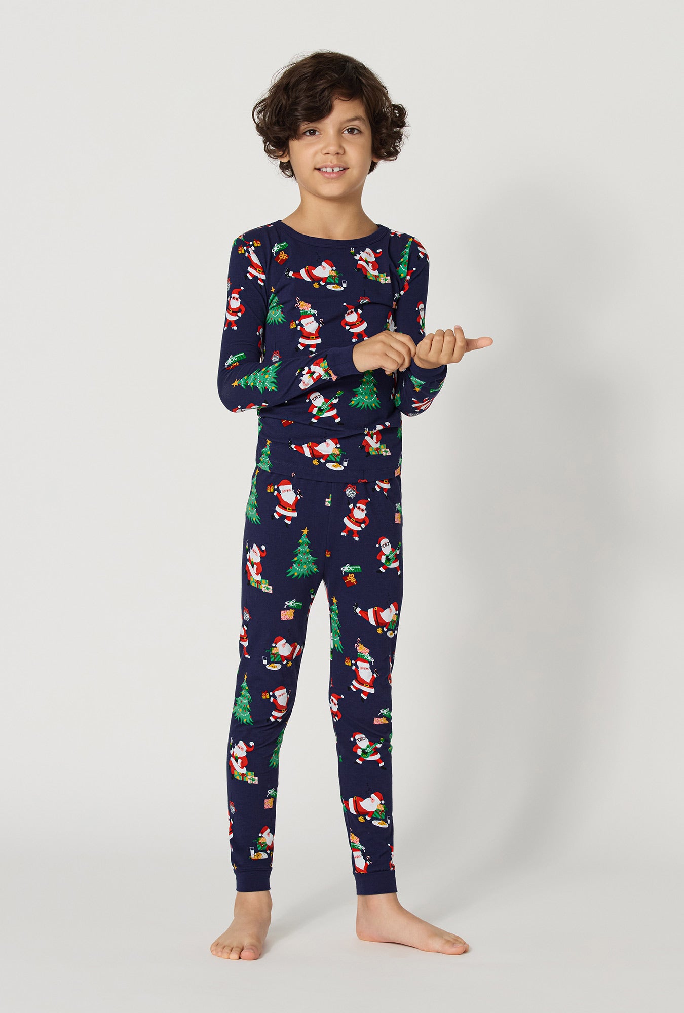 A Boy wearing Santa's Night Out Long Sleeve Stretch Jersey Kids Pj Set
