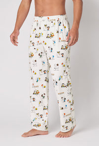 A Man Wearing Snoopy's Game Day Men's Stretch Jersey Pj Pant in a side angled pose
