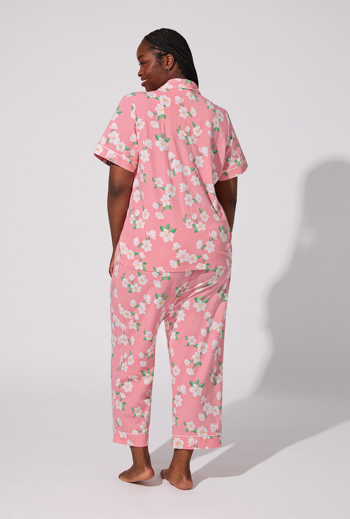 A lady wearing Pink Magnolias Short Sleeve Classic Stretch Jersey Cropped PJ Set