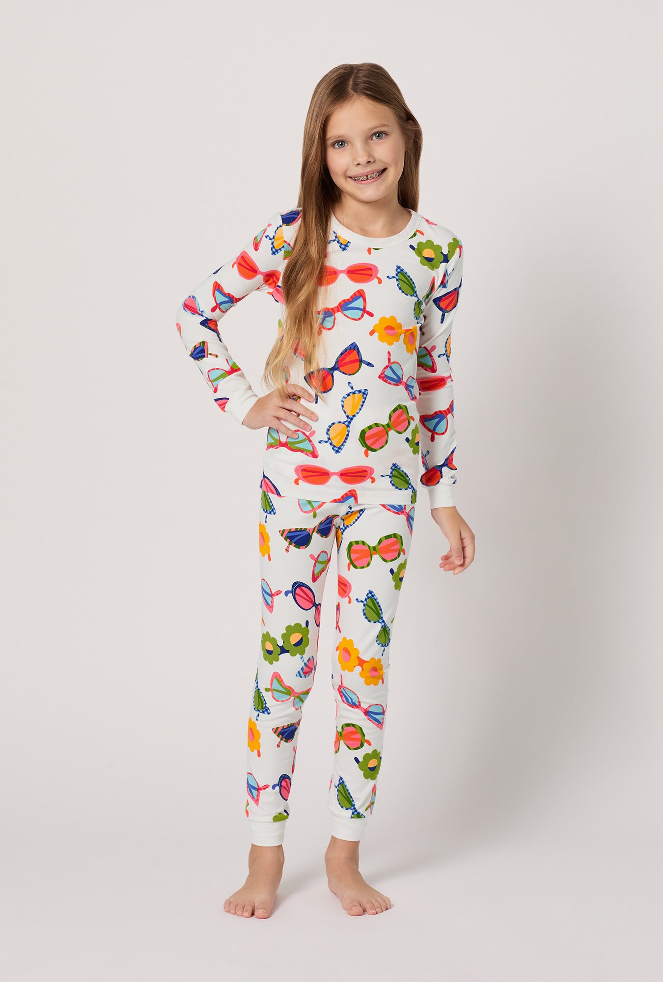 A girl wearing Made In The Shade Long Sleeve Stretch Jersey Kids Pj Set