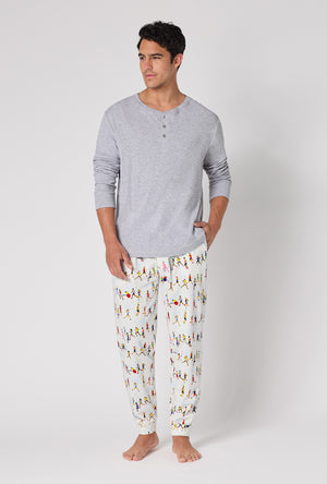 A Man wearing Run Nyc Run Men's Long Sleeve Henley And Jogger Stretch Jersey Pj Set looking side