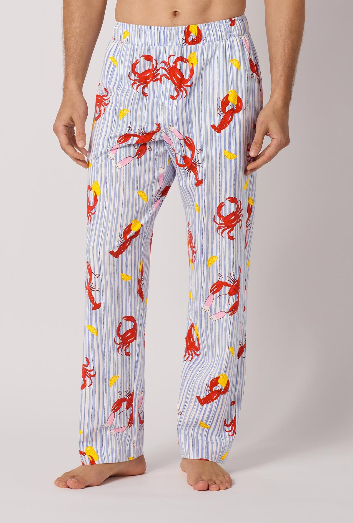 A man wearing Coastal Feast Men's Stretch Jersey Pj Pant