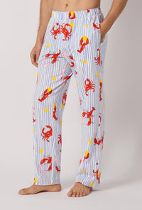 A man wearing Coastal Feast Men's Stretch Jersey Pj Pant side look