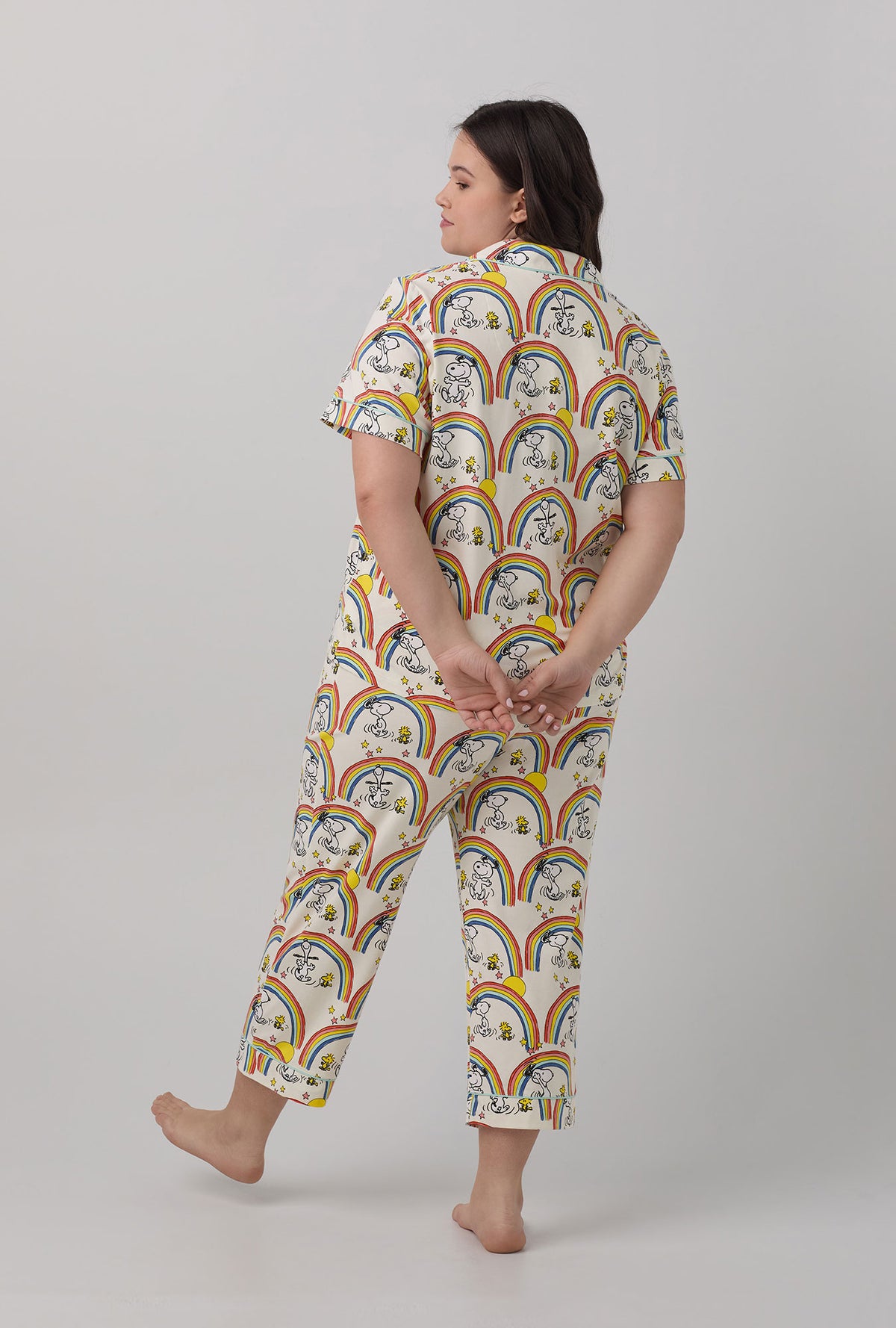 A lady wearing plus size white Short Sleeve Classic Stretch Jersey Cropped PJ Set with Sunshine Snoopy print.
