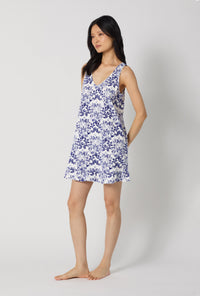 A lady wearing Under The Sea Ruffle Stretch Jersey Chemise looking side
