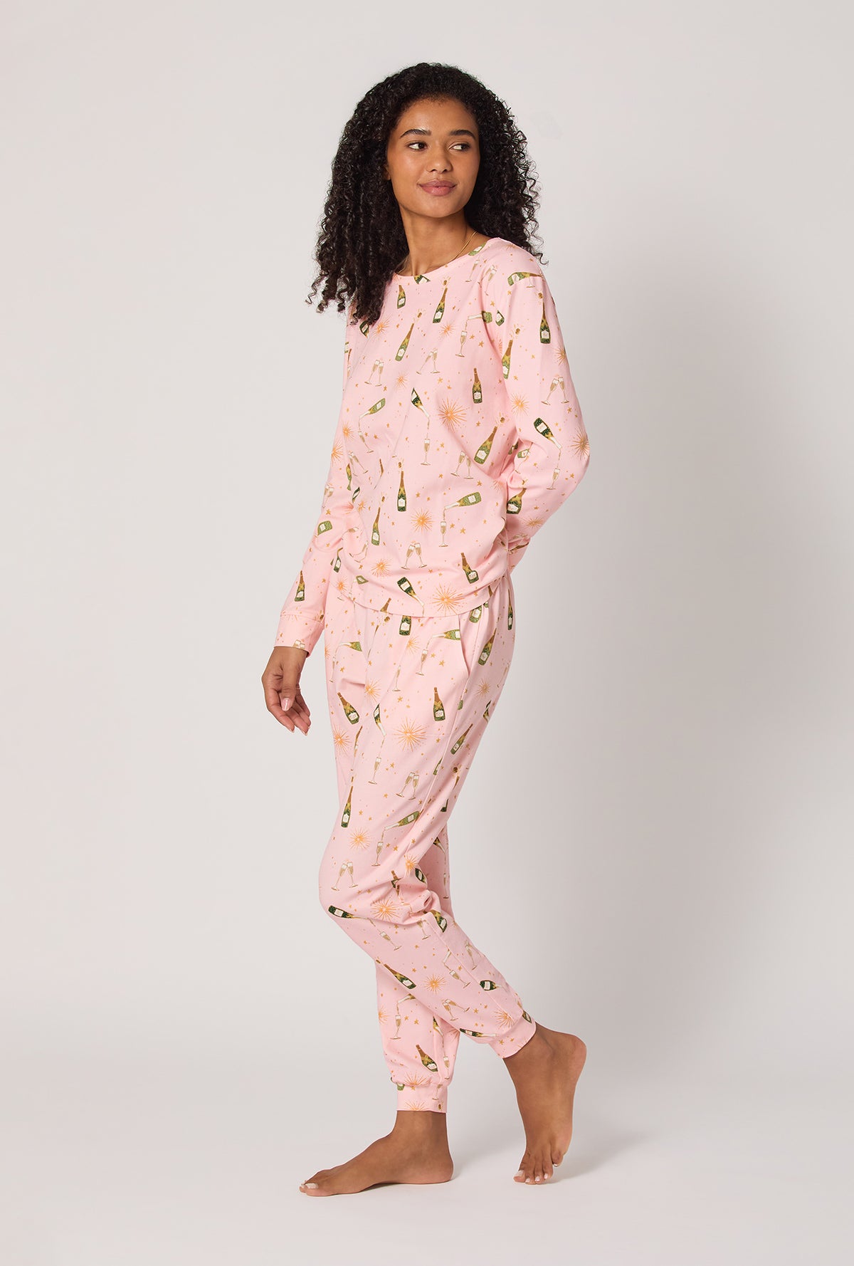 A Lady wearing Pop Fizz Clink Long Sleeve Pullover Crew And Jogger Stretch Jersey Pj Set