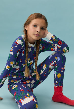 A girl wearing Alice's Adventures Long Sleeve Stretch Jersey Kids Pj Set