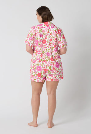 A Lady Wearing Plus Size Josephine Short Sleeve Classic Shorty Stretch Jersey Pj Set in a back view pose