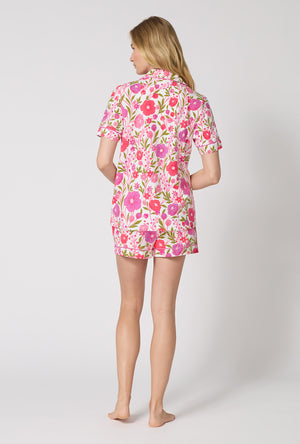A Lady Wearing Josephine Short Sleeve Classic Shorty Stretch Jersey Pj Set in a back view pose