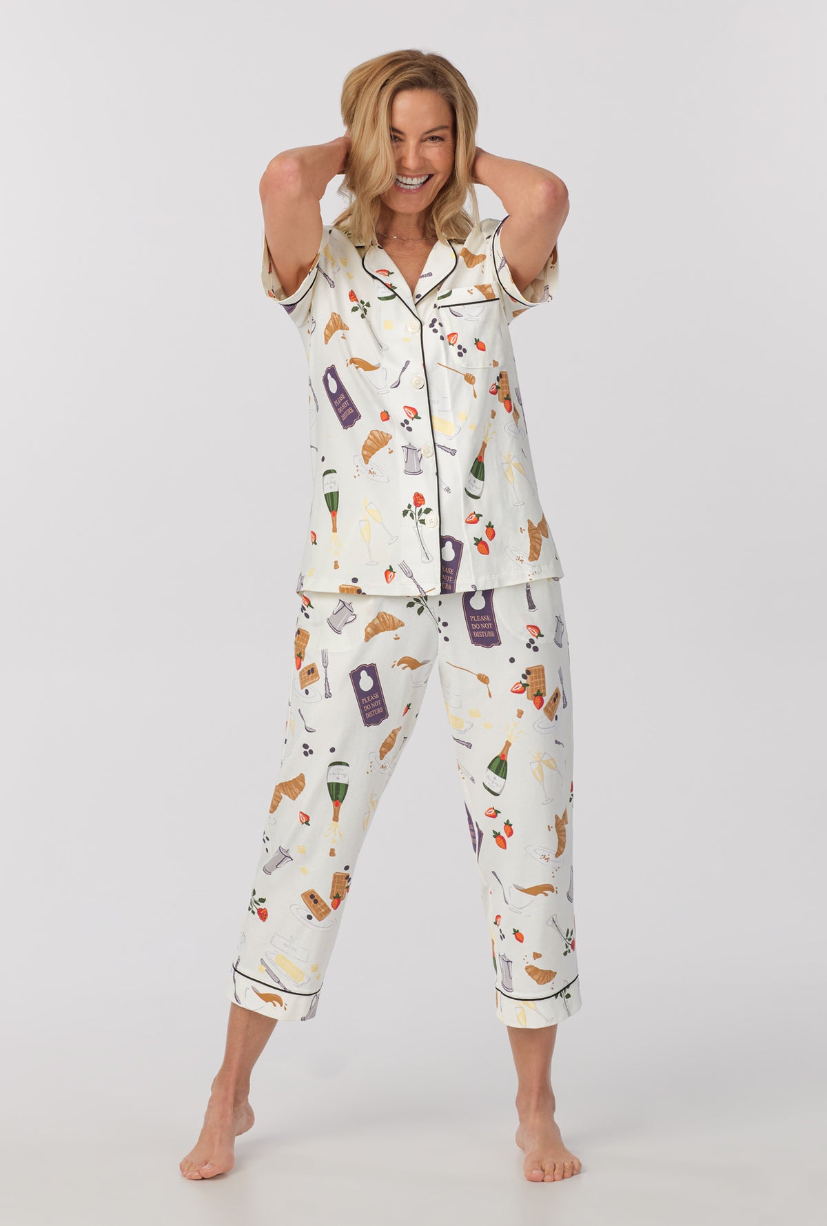 A lady wearing Short Sleeve Classic Stretch Jersey Cropped PJ Set with Breakfast In Bed print