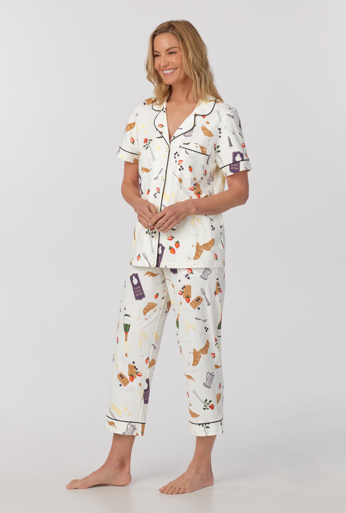 A lady wearing Short Sleeve Classic Stretch Jersey Cropped PJ Set with Breakfast In Bed print