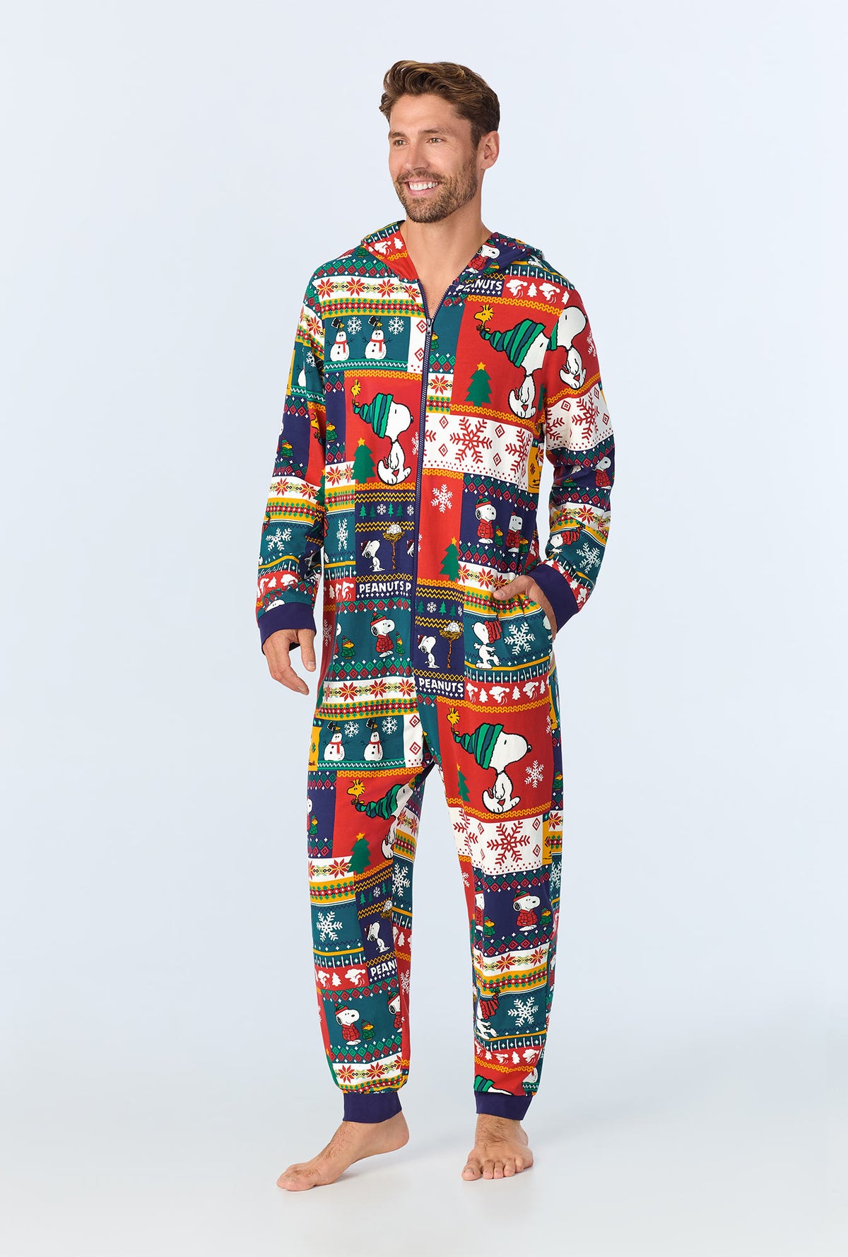 A man wearing fairisle snoopy long sleeve onesie