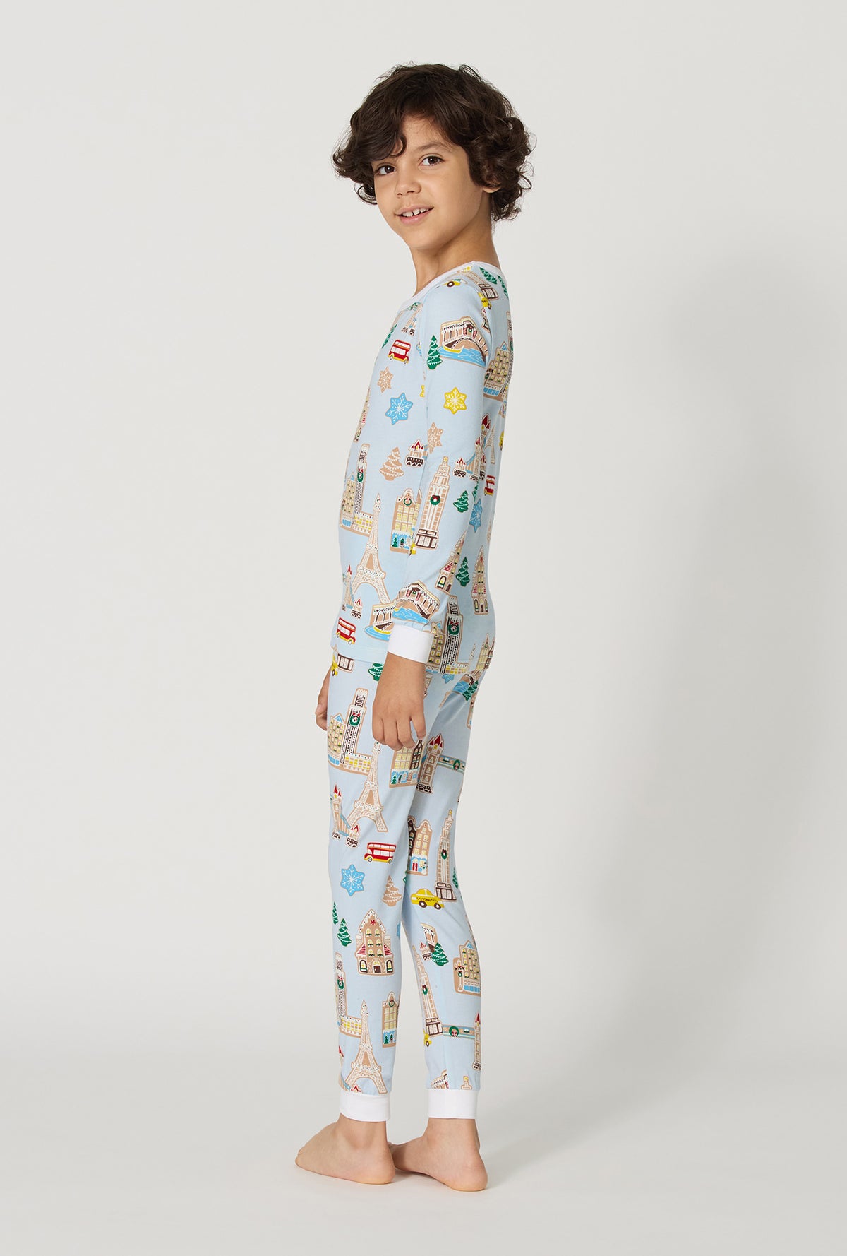 A Boy wearing Gingerbread City Long Sleeve Stretch Jersey Kids Pj Set back view
