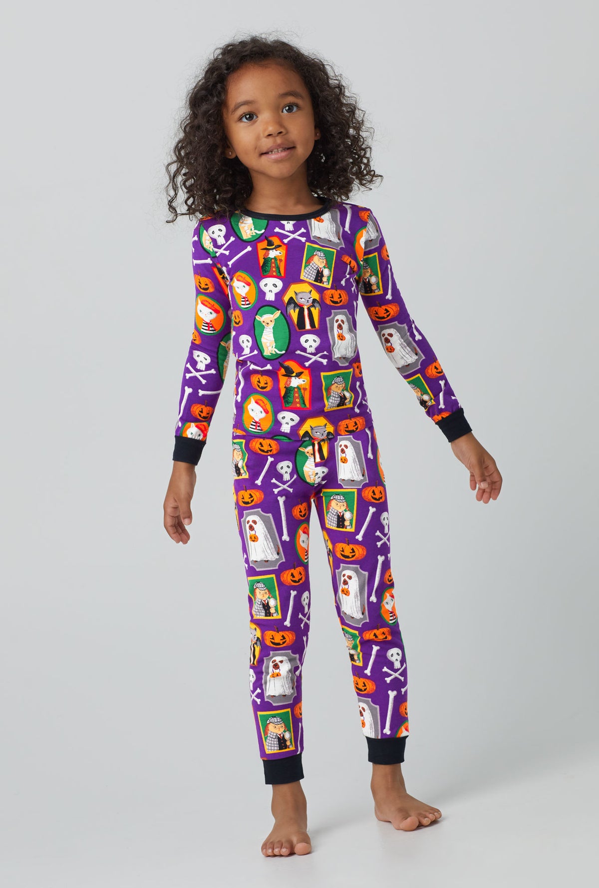 A girl wearing Long Sleeve Classic Stretch Jersey PJ Set with Trick or treat print