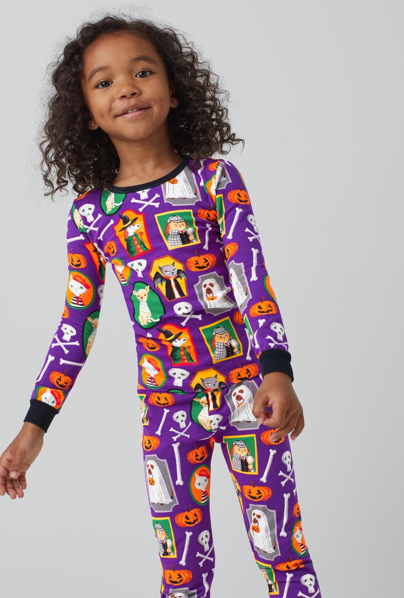 A girl wearing Long Sleeve Classic Stretch Jersey PJ Set with Trick or treat print