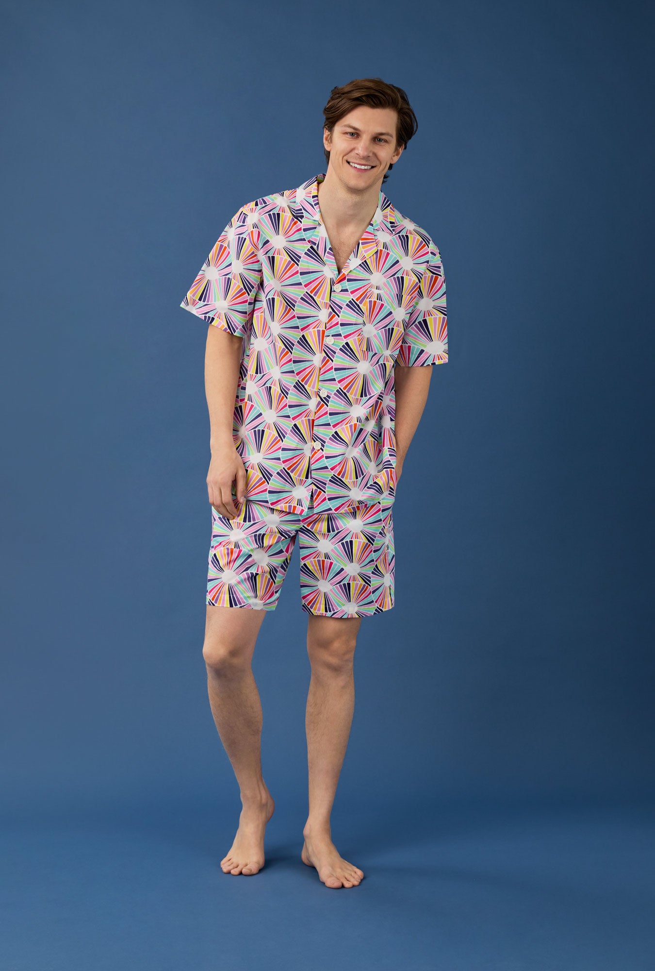 A man wearing  Fanfare Men's Short Sleeve Notch Woven Cotton Poplin Boxer PJ Set
