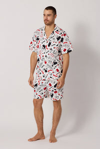 A man wearing Devil Wears Prada Men's Short Sleeve Classic Stretch Jersey Short PJ Set looking side