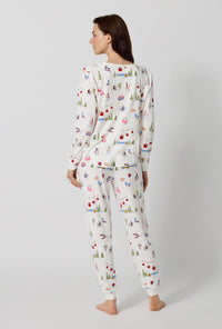 A lady wearing Snow Much Fun Long Sleeve Pullover Crew And Jogger Stretch Jersey Pj Set back view