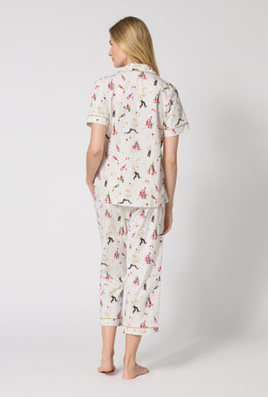 A Lady Wearing Bar A Vin Short Sleeve Classic Stretch Jersey Cropped Pj Set facing back while looking to the side